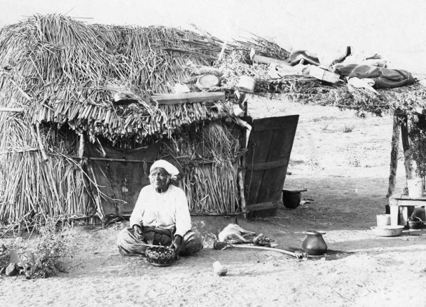 Tongva woman at her shelter covered with tule mats on the banks of Los Angeles River. Photo: Bowers Museum Collection. Source: tongvapeople.com